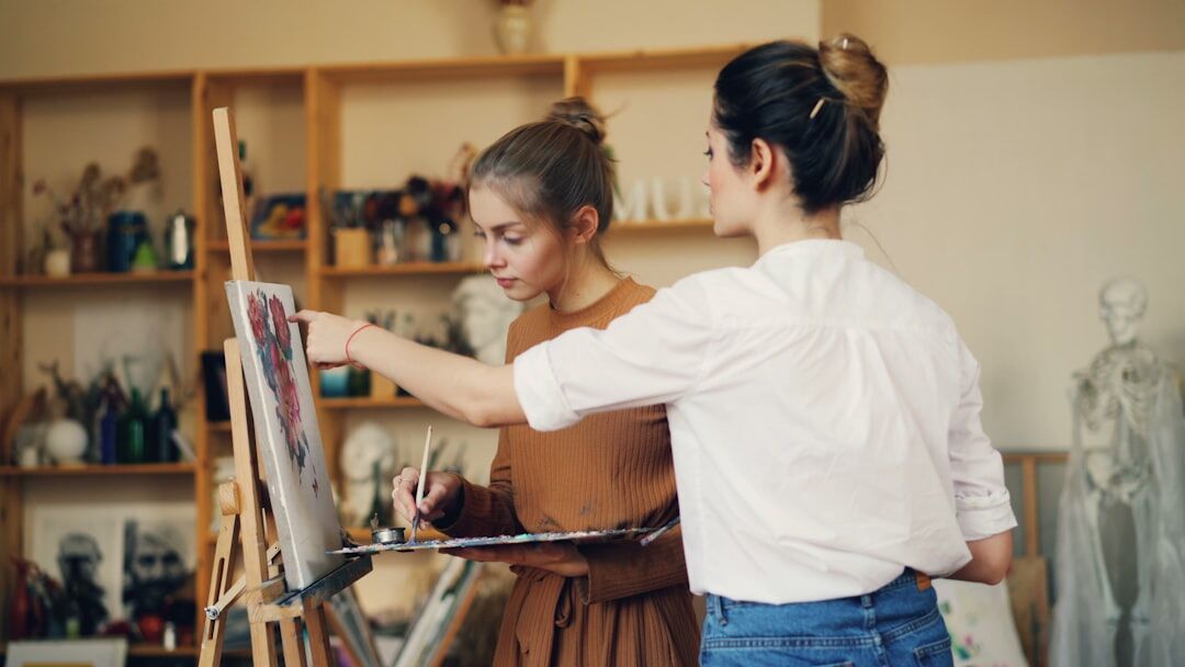 Slovak seniors painting together at a creative art workshop