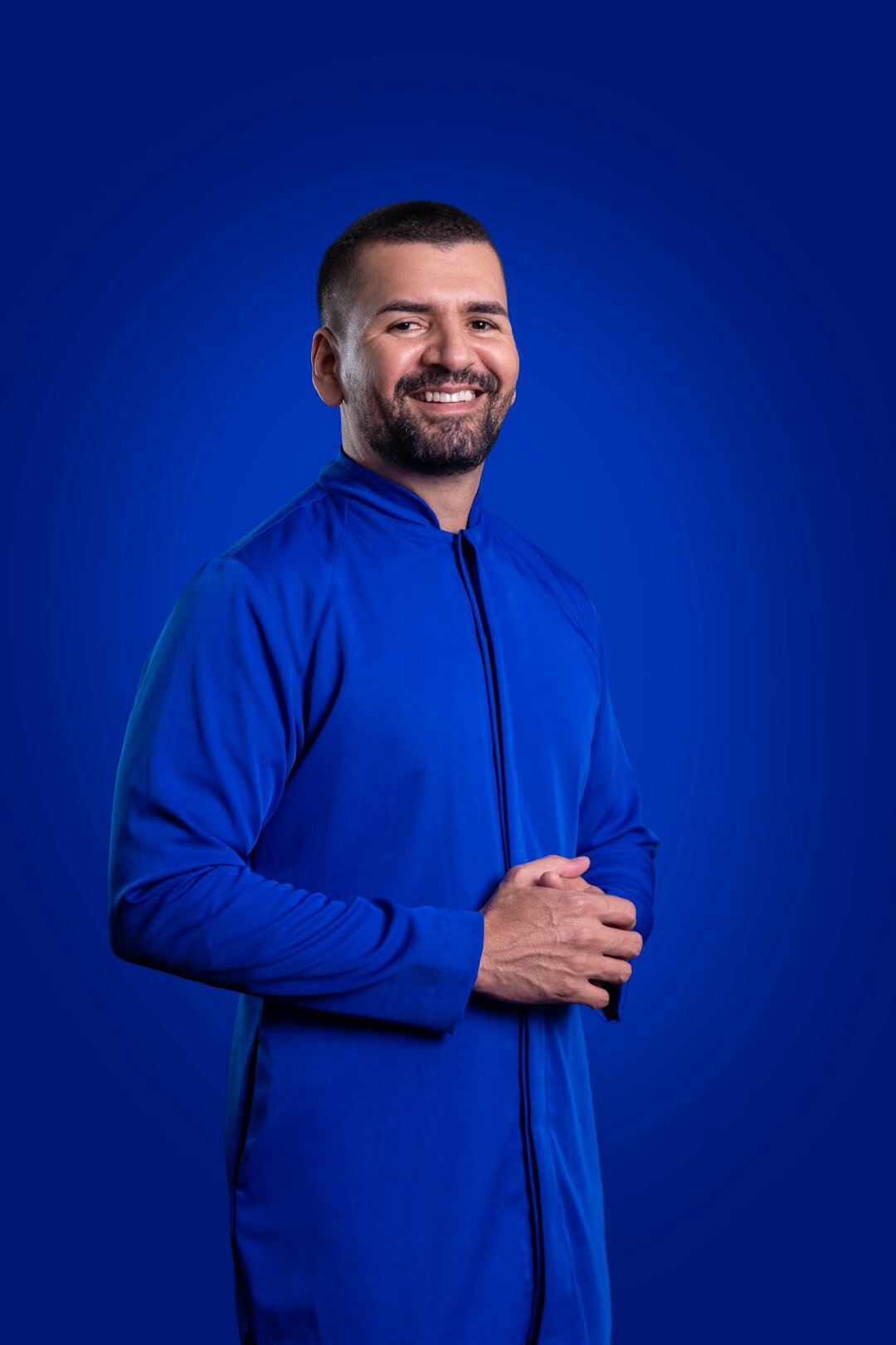 Studio portrait of a smiling middle-aged Slovak man volunteer coordinator